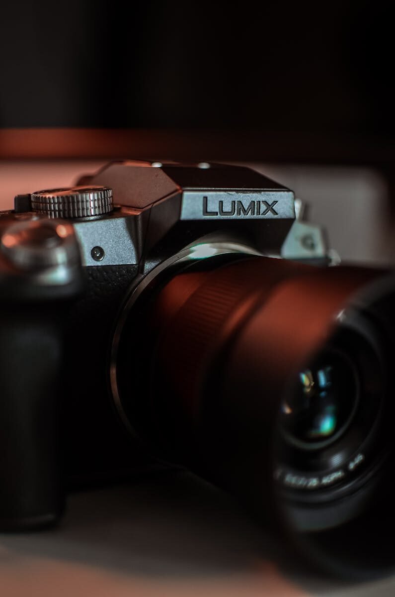 Intimate close-up of a LUMIX camera emphasizing the lens, ideal for photography enthusiasts.